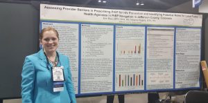 MPH Student Melanie Rogers and her first place poster