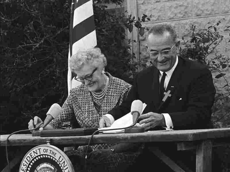1965: President Lyndon Johnson signs the Elementary and Secondary Education Bill into law