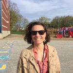 Rachael Flaxman in front of a playground
