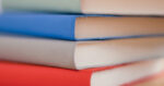 A stack of books such as those that the library can offer as resources