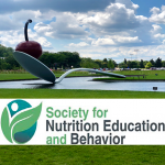 society for nutrition education and behavior logo against a nature background