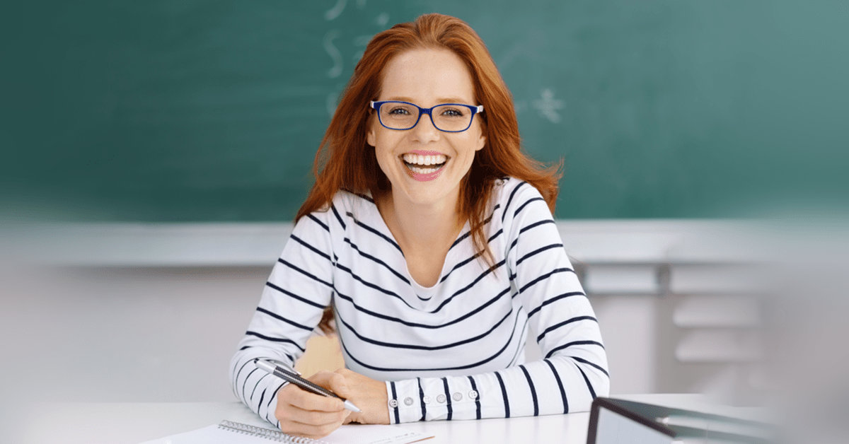 Teacher laughing as she undergoes supervision and evaluation