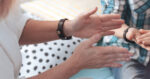 A school social worker in her role gesturing to a student to assist him with his issue