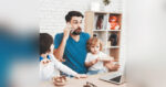 young dad working and homeschooling