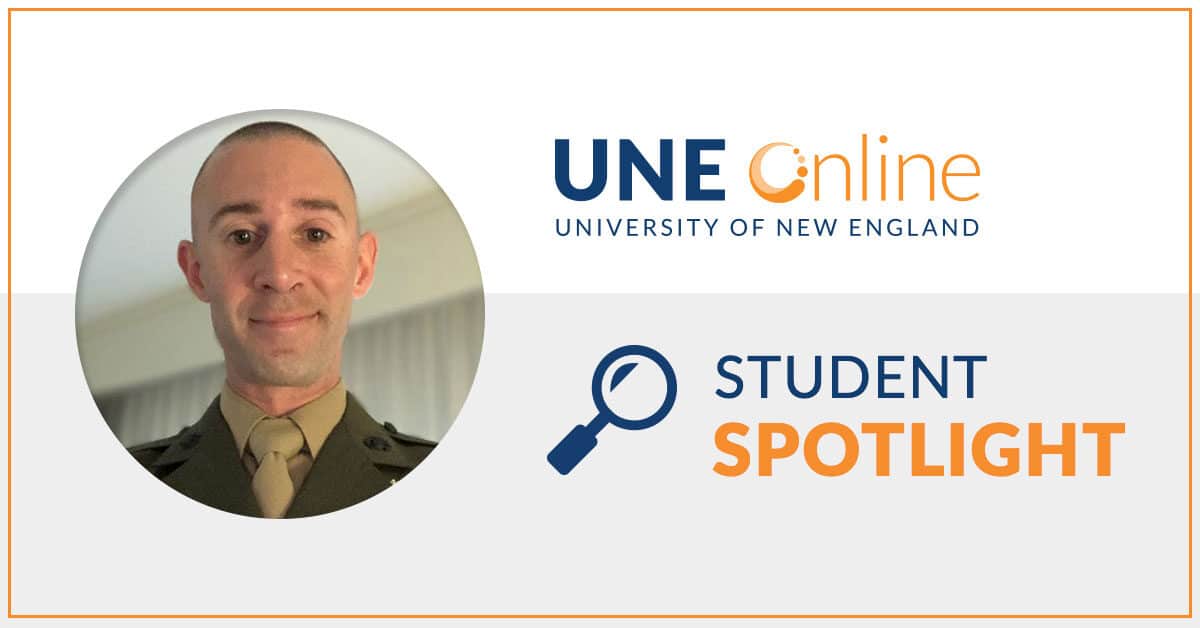 Kenneth Palmer, MSW student, stands in his Navy Uniform