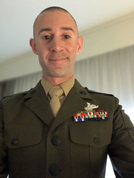 Kenneth Palmer, MSW student, stands in his Navy Uniform