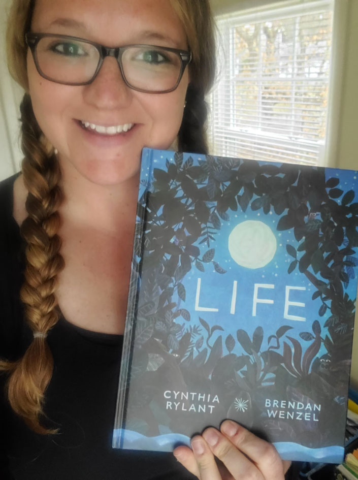 Jessica Swindlehurst with the book "Life" by Cynthia Rylant