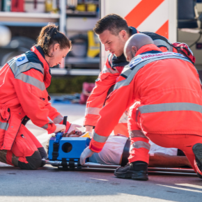 Paramedics helping injured person