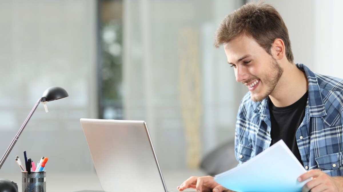 Man working online at home on a laptop