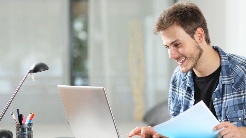 Man working online at home on a laptop