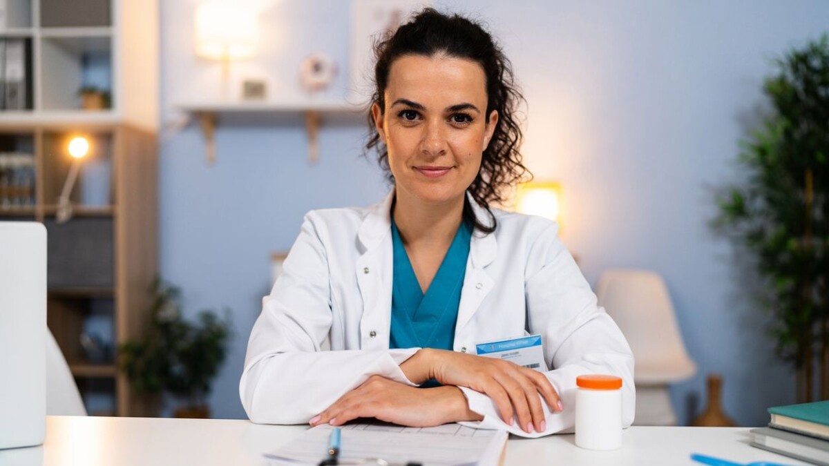 Portrait of Caucasian female doctor, working at the ordination