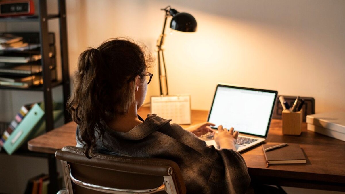 Teen girl doing homework on her laptop