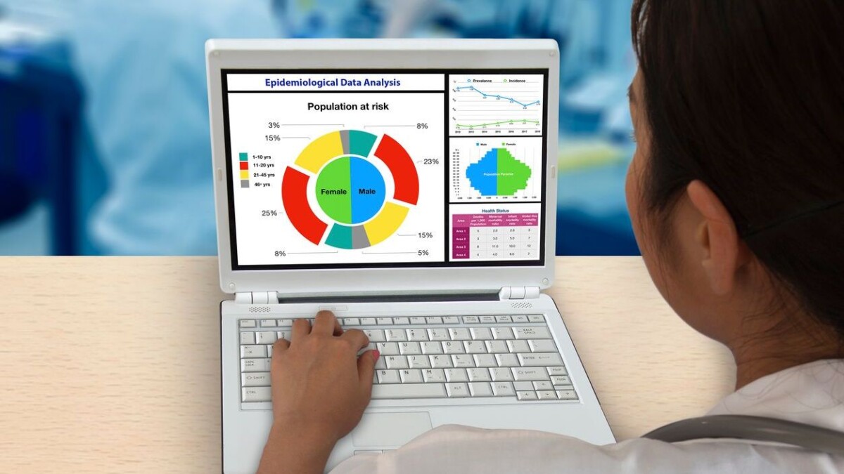 Female doctor working on notebook computer to analyse epidemiological data.