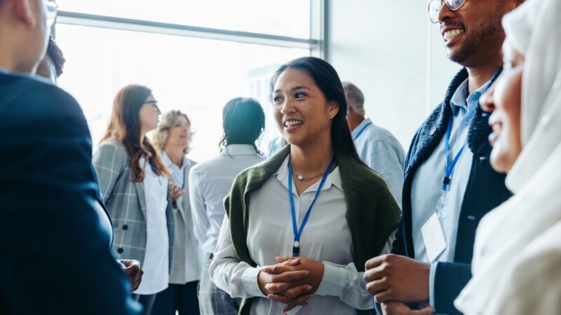 Diverse business professionals networking at a conference event