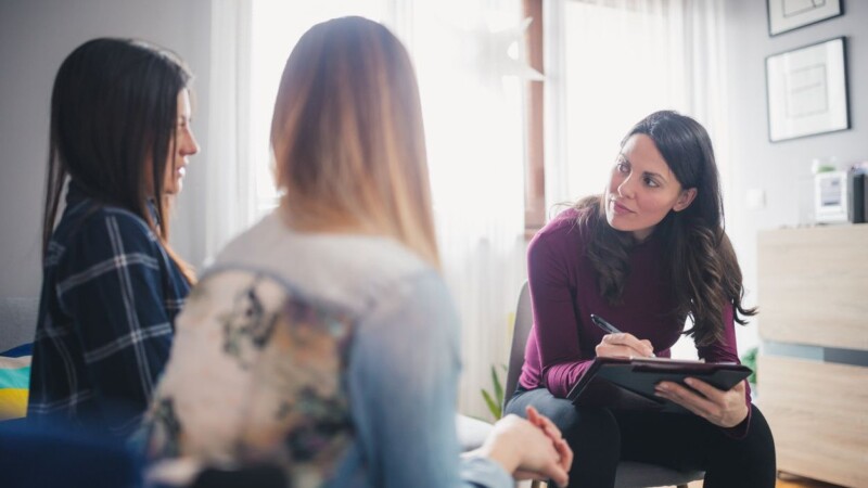 Counselor advising teens